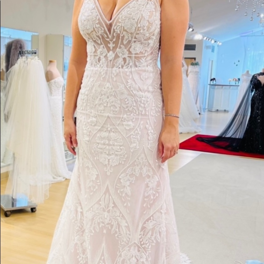 This wedding dress is unadvertised, limited edition/private collection.